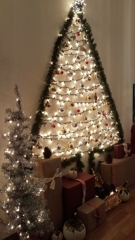 Christmas wall Tree Wall Lights Christmas Tree, Xmas Tree On Wall With Lights, Wall Tree Christmas Diy, Wall Light Christmas Tree, Christmas Wall Tree Ideas, Light Christmas Tree On Wall, Christmas Tree On Wall With Lights, Christmas Tree Ideas On The Wall, Garland Tree On Wall