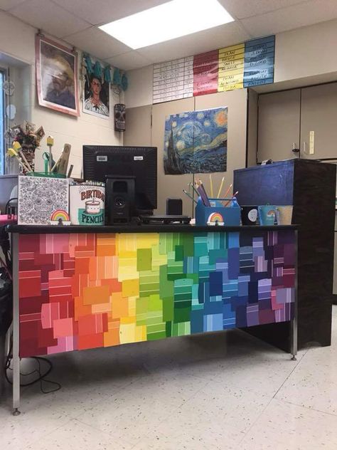 Rainbow Desk Decor, Preschool Front Office Ideas, Diy Rainbow Classroom Decor, Paint Chip Bulletin Board, Preschool Art Room Decor Classroom Ideas, Cheap Easy Classroom Decor, Art Room Windows, Art Teacher Desk Organization, Paint Chip Decor