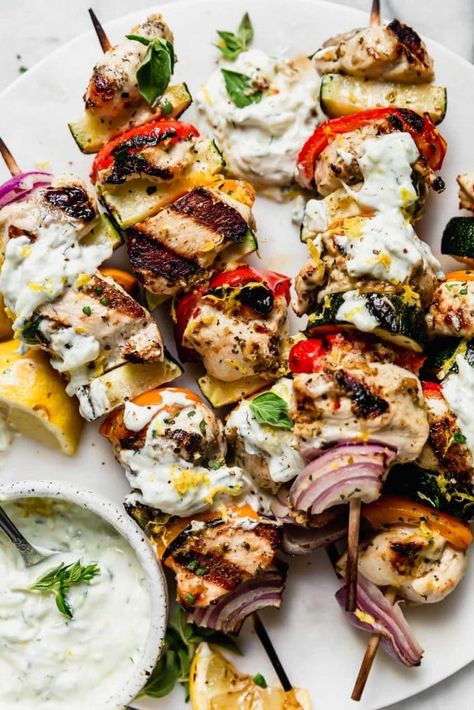 Grilled Chicken Kebabs with Tzatziki Sauce | Marinated in Greek flavors then grilled to perfection, these Greek Chicken Kebabs make for an easy, flavorful and healthy dinner! We like to dip or drizzle the kebabs with Tzatziki Sauce to add even more of an authentic and delicious flavor. A recipe you’ll want to try! || The Real Food Dietitians Authentic Greek Food, Greek Chicken Kebabs, Greek Chicken Kabobs, Weekend Meal Prep, Dorito Casserole, Tzatziki Sauce Recipe, Real Food Dietitians, Greek Foods, Greek Flavors