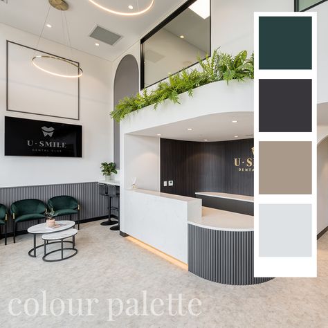 The grand, double-height entrance emphasises the uniqueness of this fitout by harnessing the sense of space and light, while soft touches of greenery and wall panelling bring a more human scale and feeling of approachability. #dentist #dentalclinic #dentistdesign #elegant #brown #beige #colourpalette #greenery #interiordesign #interior #emerald #green #lightdesign #bulkhead #reception #clinic #healthcarespace #dentaloffice Green Dental Clinic, Reception Clinic, Dental Clinic Logo, Dental Logo Design, Human Scale, Dental Office Design Interiors, Double Space, Clinic Interior, Clinic Logo