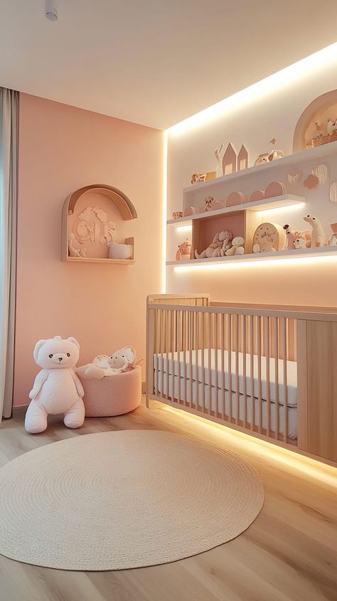 Tranquil gender-neutral nursery with pastel pink walls, wooden crib, beige rug, and warm lighting, creating a calm Light Peach Nursery, Nesting Baby Room, Peach Baby Room, Baby Room Girl Ideas, Simple Baby Room Ideas, Twin Baby Room Ideas, Twin Nursery Themes, Neutral Baby Girl Nursery, Twin Nursery Gender Neutral