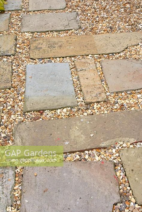 Stone paving slabs and gravel path Gravel Path With Pavers, Gravel And Paving Patio, Slab And Gravel Patio, Paving Slabs And Gravel, Garden Seating Area Ideas Gravel Patio, Paving And Gravel Ideas, Rustic Pavers, Paving Slabs Ideas, Permeable Patio