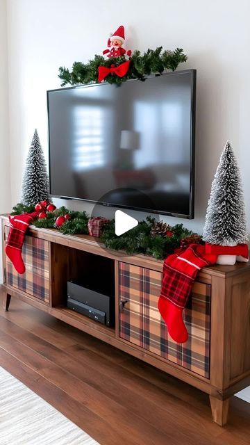 Lovely Harbor on Instagram: "Spark Christmas joy with trendy TV stand decor ideas for 2024. Layer twinkling lights, festive garlands, and charming ornaments for holiday vibes in your living space." Christmas Decor Ideas For Tv Stand, Garland On Tv Stand, Decor Ideas For Tv Stand, Ideas For Tv Stand, Tv Stand Decor Ideas, Tv Stand Decor, Holiday Vibes, Twinkling Lights, Twinkle Lights