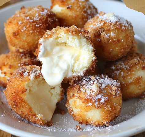 Treat yourself to a heavenly indulgence with these Crispy Fried Cheesecake Bites. Imagine creamy cheesecake filling wrapped in a golden, crispy shell, offering a perfect contrast of textures and flavors in every bite. Whether served as a decadent dessert or a delightful snack, these fried cheesecake bites are sure to be a hit at any... Fried Cheesecake Bites, Fried Cheesecake, Cheesecake Fruit Salad, Cheesecake Bites Recipe, Frozen Cheesecake, Buttered Corn, Summer Baking, Classic Cheesecake, Peanut Butter Cheesecake