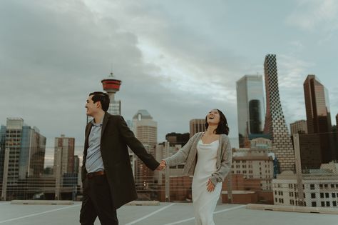 On a warm February evening, amidst the vibrant cityscape of downtown Calgary, Camille and Jamie celebrated their love in a unique and... Nyc Shoot, Calgary Downtown, Downtown Couple, Urban Elopement, Street Couple, Downtown Calgary, Rooftop Engagement, Night Shoot, Couples Shoot