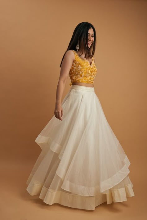 Ajrakh Skirt And Top, Skirt And Top Indian Simple, White Crop Top Lehenga, White And Yellow Lehenga, Lehenga Designs Simple Latest, White Lehenga Skirt, Haldi Ceremony Outfit For Sister, Yellow Haldi Outfit, Yellow Skirt Outfits