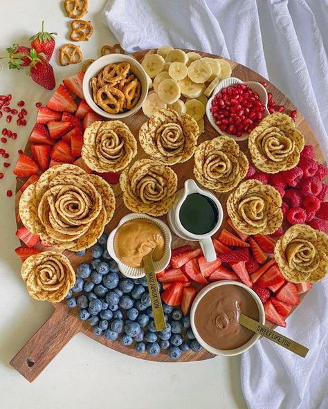 Ashley Pellizzaro on Instagram: "Crêpe Roses Platter! Yay or Nay? 🥞🍫🥜 I know people tend to have a favourite between crepes, pancakes and waffles but I kinda love them all! Have you seen salami roses on cheese or charcuterie boards? Well, use the same technique with crepes and create a fabulous breakfast or brunch board! The best thing about this is you can do a sweet or savoury option! What are your favourite toppings? . . . #breakfastboard #breakfastplatter #grazingplatter #plattergoals #gr Breakfast Charcuterie Letters, Crepe Board Ideas, Pancake Breakfast Board, Crepes Board, Crepe Charcuterie Board, Pancake Charcuterie Board Ideas, Pancake Board Ideas, Breakfast Graze Board, Crepe Board