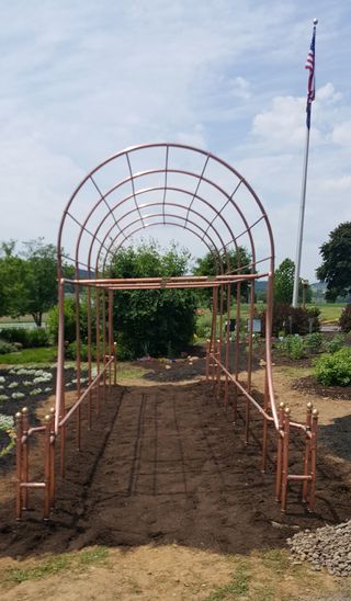 This project is part of a much larger one that I assisted with for the past year. My wife is a member of the Penn State Lycoming County Master Gardeners and was the... Garden Retaining Wall, Backyard Garden Landscape, Diy Trellis, Sensory Garden, Small Backyard Gardens, Garden Arches, Trellis Design, Diy Pergola, Copper Pipe