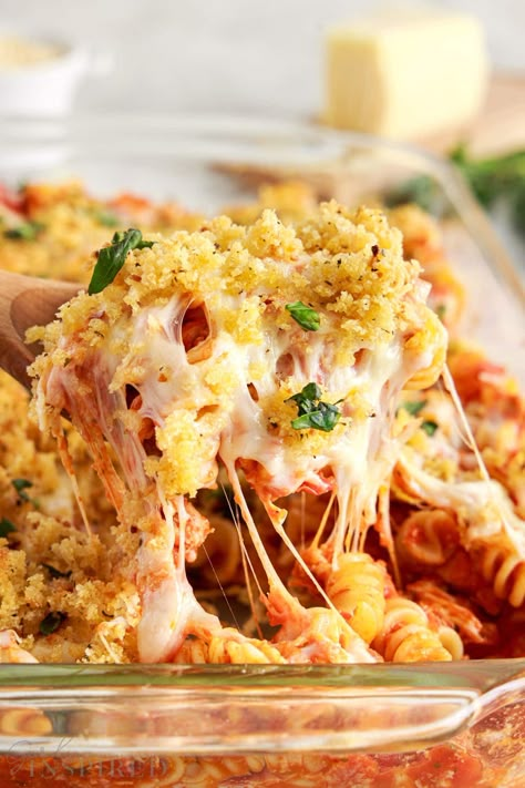 Enjoy this chicken parmesan pasta bake in a casserole dish that is ready in just 35 minutes, but has the same great traditional flavors. It's cheesy, filling, and topped with toasty breadcrumbs. Easy Chicken Parmesan Casserole With Pasta, Chicken Parmesan Casserole 12 Tomatoes, Pasta Bake With Breadcrumbs, Park Chicken Casserole, Chicken Parm Noodles, Popcorn Chicken Parmesan Casserole, Baked Chicken Parmesan Pasta, Chicken Parm Pasta Casserole, Baked Chicken Parm Casserole