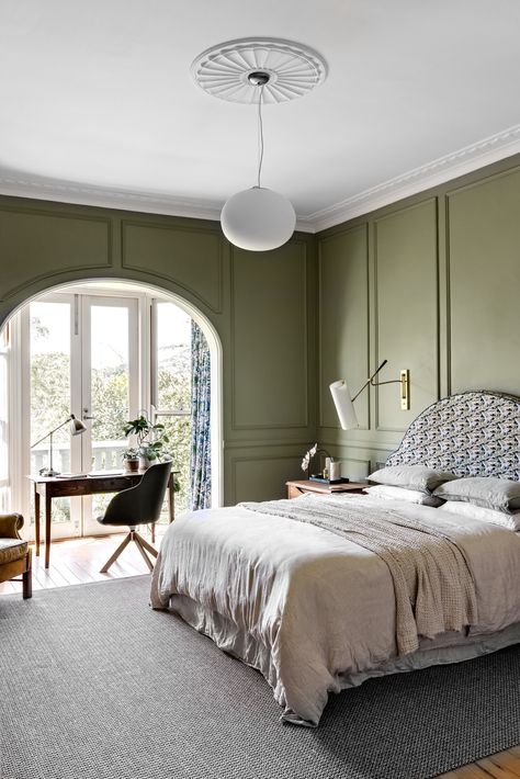 Muted hues and a statement arch are an elegant touch to this bedroom. Wainscoting Bedroom, Bedroom Victorian, Victorian Bedroom, Bedroom Pendant, Muted Green, Inside Interiors, Green Bedroom, Clean Bedroom, Green Tone