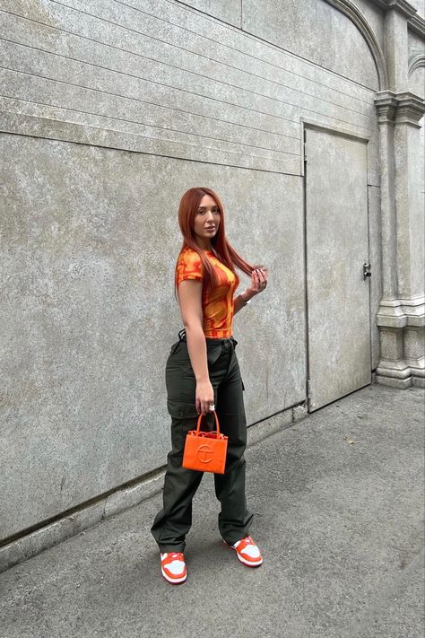 Styling Jean Vintage Cargo Pants | Miaou Orange Tee | Telfar Mini Bag | Wmns Dunk ‘High Syracuse’ Syracuse Dunks Outfit, Orange Bag Style, Telfar Mini Bag, Orange Telfar, Orange Dunks, Dunk Outfit, Vintage Cargo Pants, Tote Bag Outfit, Dunks Outfit