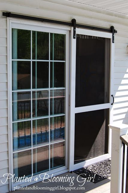 When this blogger bought her home she intended to replace the back door with a wood one. After realizing that the rustic look would clash with her colonial-style home, she opted to hang a screen door using sliding hardware instead. Man Home Decor, Diy Screen Door, Sliding Screen Doors, Decor Ikea, Diy Barn Door, French Door, Interior Barn Doors, Diy Door, Barn Doors Sliding