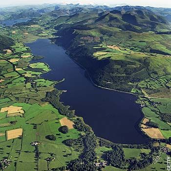 Bassenthwaite Lake ~ Western Lake District ~ UK.   Have walked around most of this lake and we go and stay in a little village within walking distance from the lake each year. There are also Ospreys that nest on this lake and I love watching them flying and fishing. Wonderful, peaceful place to visit. Bassenthwaite Lake, Cumbria Lake District, Lakeside House, Cumbria England, Lake District England, Places In England, West England, Ireland Landscape, Northern England