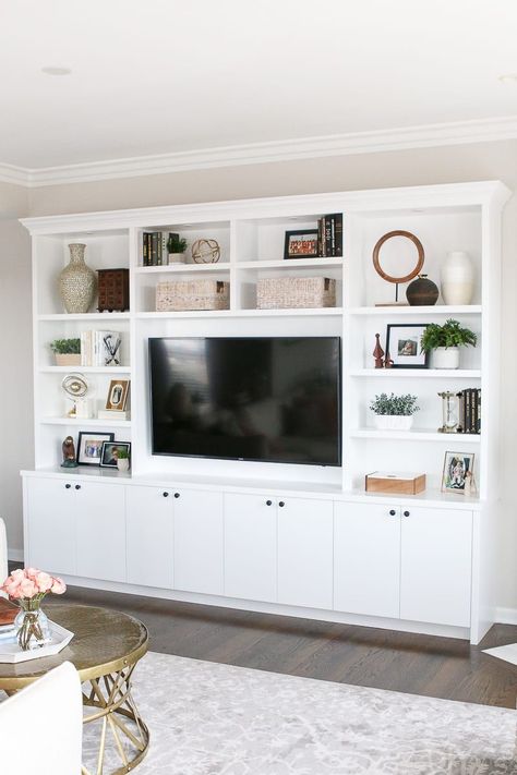 These white built-ins in this blush family room have lots of storage and room for accessories White Built Ins, Built In Shelves Living Room, Living Room Built Ins, Living Room Wall Units, Living Room Entertainment Center, Living Room Entertainment, Entertainment Center Decor, Neutral Living Room, Living Room Remodel