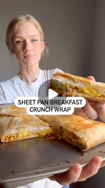 Andrea on Instagram: "Sheet Pan Breakfast Crunchwrap

1. Take a sheet pan and spray with a little oil.
 Lay 5 burrito tortillas down with one in the  middle and the edges hanging off.(video before this for reference)
2. Now spread Taco Bell chipotle creamy sauce on the first layer.
3. Take 8 cooked hash brown patties for the next layer.
4. Top with cooked eggs.
5. Now top with one pound of cooked sausage or bacon.
6. Last layer will be 1 1/2-2 cups of shredded cheese. 
7. now take 3 more burrito tortillas and lay them on top wrapping them under a bit too.
8. Spray top with oil.
9. Lay another cookie sheet on the top.
10. Bake at 450 degrees for 15-20 minutes.
11. Enjoy!!

Ingredients:

8 burrito tortillas 
Taco Bell chipotle creamy sauce
8 hash brown patties
4-8 eggs
1 pound sausage or bac 5 Layer Burrito Taco Bells, Sheet Pan Breakfast Quesadilla, Egg Tortilla Breakfast, Tortilla Breakfast Ideas, Bacon Breakfast Ideas, Healthy Breakfast Wraps, Sheet Pan Breakfast, Easy Egg Breakfast, Breakfast Crunchwrap