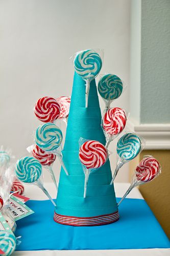 How To Make a Lollipop Stand.  ...would be great to use at Birthday parties or for any holiday - customizing color scheme to fit any occasion! Cat In The Hat Birthday, Custom Lollipops, Dr Seuss Party Ideas, Lollipop Stand, Hat Birthday Party, Cat In The Hat Party, Lollipop Tree, Dr Seuss Birthday Party, Blue Cotton Candy