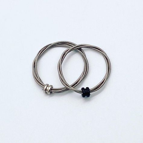 Upcycled guitar strings; cleaned, fashioned and secured by the ball end. Silver tone with colored ball end. Guitar String Ring, String Ring, Guitar String Jewelry, String Jewelry, Guitar Strings, Silver Bracelet, Silver Tone, Guitar, Ring