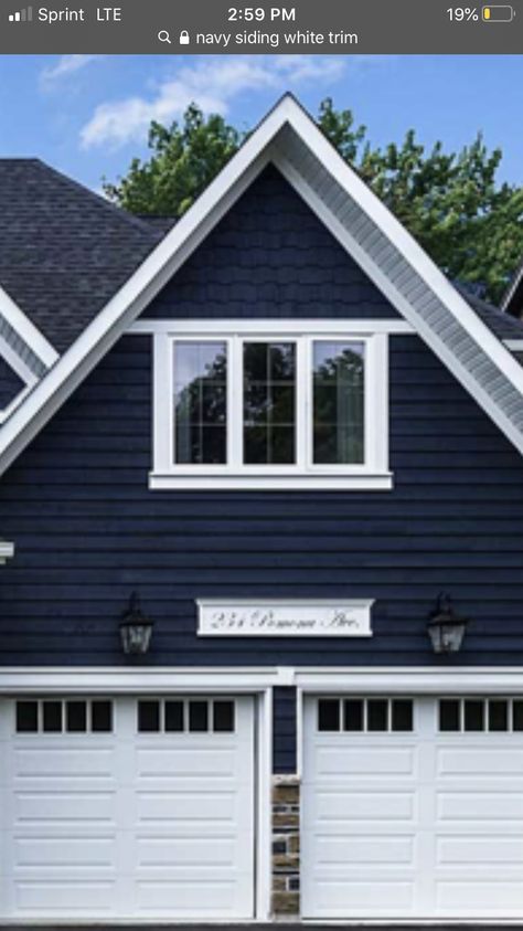 Navy Blue White Trim Exterior, Navy Blue Siding House White Trim, Navy Blue Stucco House Exterior, Navy Blue House Exterior White Trim Garage Doors, Midnight Blue Siding House, Navy Blue Ranch House Exterior, Navy Blue Lake House Exterior, Dark Blue House Exterior, Bungalow Exterior Colors