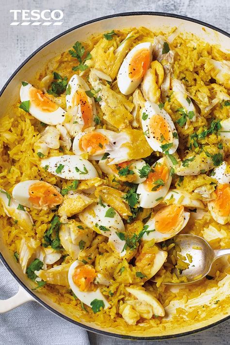 This ultimate kedgeree recipe proves just why this dish is a timeless classic. Fluffy spiced rice, flaked smoked haddock and golden soft-boiled eggs are a combination that works for brunch, lunch or dinner. | Tesco Kedgeree Recipe, Curried Rice, Eggs Healthy, Haddock Recipes, Smoked Haddock, Recipe Rice, Comforting Dinner, Spiced Rice, Easy Rice