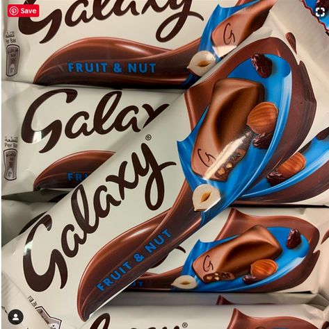 The Galaxy Fruit and Nut bar has returned to UK shores and chocoholics are delighted  The bar was discontinued here "years ago".  And now fans of the fruity, creamy, nutty chocolate are thrilled to hear it's back.  The bar features the creamiest Galaxy milk chocolate studded with hazelnuts and sultanas.  For those who haven't tried it, it's just like a Cadbury Dairy Milk Fruit and Nut, but sweeter. Cadbury Chocolate Photography, Chocolate Bark With Nuts And Fruit, Cadburys Chocolates, Cadbury Nutties, Cadbury Fruit And Nut, Galaxy Chocolate, Fruit And Nut Bars, Nut Bar, Cadbury Dairy Milk