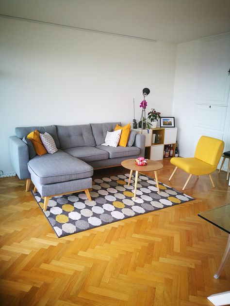 Yellow, white and grey are the colors I chose to reinforce the pre-existent wonderful light of my living room, powerfully highlighted by the white walls and the wood flooring. Ikea carpet, Maisons du Monde armchairs and table, Ikea furnitures. Grey Navy Mustard Living Room, Ikea Carpet Living Rooms, Mustard Armchair Living Rooms, Yellow Wood Floors Living Rooms, Grey And Mustard Living Room Ideas, Yellow Armchair Living Room, Grey Yellow Living Room, Rustic Living Room Designs, Ikea Carpet