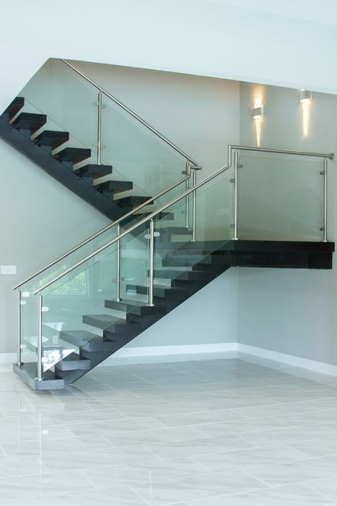 This mono stringer floating staircase features our Axia series round stainless steel railing. Same day pick-up & delivery options available. Click on the link below or call one of our 3 TX locations for free estimates. ​ ​Houston: 281-209-0000 DFW: 817-701-2006 Austin: 512-973-8373 ​ ​#stairparts #stairremodel #stairs #remodel #interiordesign #staircompany #remodelcompany #stairmakeover #austin #dallas #houston #remodeling #homeremodel #renovation #design #construction Steps Glass Railing Design, Stair Railing Ideas Glass And Steel, Stair Railing Design Stainless Steel, Steps Design Interior Stairs Steel, Glass Railing Stairs Stainless Steel, Stainless Steel Staircase, Balcony Glass Design, Steel Railing Design, Stainless Steel Balustrade