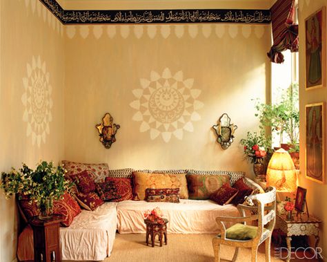 At her fanciful Manhattan lair, globe-trotting  photographer Calliope conjured an exotic corner with stenciled walls and a low slipcovered banquette layered with hand-blocked bolsters and antique embroidered pillows. (August/September 1993)   - ELLEDecor.com Indian Interior Design, Living Room Decor Indian, Moroccan Living Room, Indian Living Rooms, Indian Interiors, Perspective Art, Eclectic Living Room, Indian Decor, Meditation Room