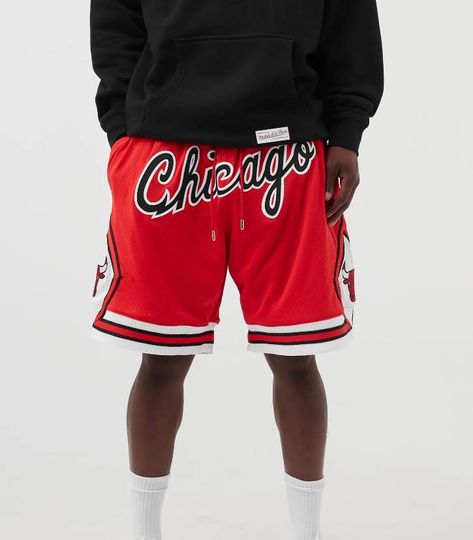 HOOPER BULLS VINTAGE BASKETBALL SHORT IN RED Introducing the must-have item for basketball enthusiasts this summer – the Chicago Bulls Vintage Embroidered Basketball Shorts. Crafted for both men and women, these shorts offer the perfect blend of style, comfort, and functionality. Whether you're hitting the courts or lounging at home, these shorts are designed to keep you cool, comfortable, and looking effortlessly stylish. Premium Quality and Design: Made from high-quality polyester fiber,... Chicago Bulls Shorts, Chicago Bulls Logo, Nba Fashion, Vintage Basketball, Nike Sale, Embroidered Shorts, Nike Blazer, Must Have Items, Gym Shorts