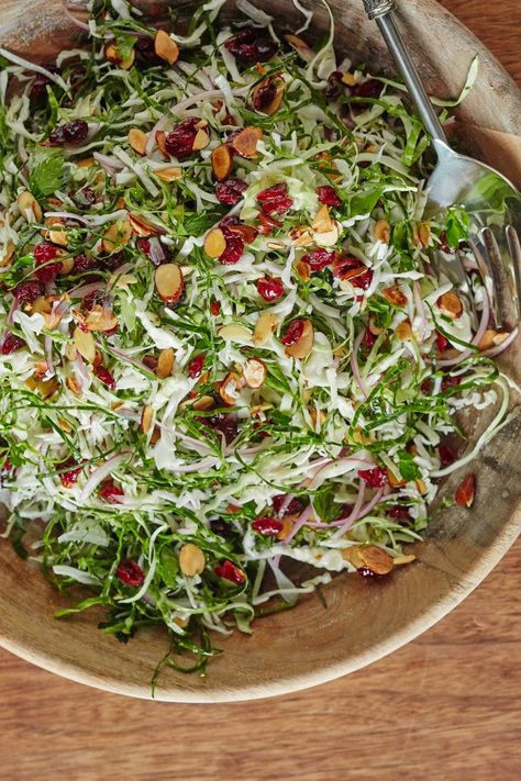 Almond and Cranberry Thanksgiving Slaw Recipe. Your Thanksgiving menu - whether classic or modern - doesn't need salad recipes for ideas for side dishes: it needs this slaw! No sides will top the delicious, vegetarian, healthy flavors and textures in this dish. It's even great for a high fiber lunch to make ahead and pack for work, or a weeknight addition to dinner. Thanksgiving Slaw, High Fibre Lunches, Friendsgiving Recipes, Thanksgiving Recipes Side Dishes Veggies, Thanksgiving Salad, Thanksgiving Food Sides, Make Ahead Salads, Slaw Recipe, Lunch Appetizers