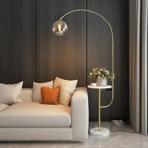 A sophisticated gold floor lamp makes it easy to add a pop of glamour to any space. We’ve collected our favorite gold-finished floor lamps from across the web – something for every style and every illumination situation. Here you’ll find traditional gold floor lamps with timeless appeal, ultra-modern floor lamps to satisfy the trendsetter, budget-friendly […] Living Room Standing Lamp, Standing Lamp Living Room, Modern Arc Floor Lamp, Stylish Floor Lamp, Floor Light, White Lamp Shade, Metal Floor Lamps, Stand Light, Arc Floor Lamps