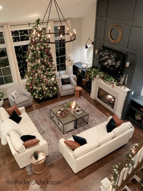 Our Warm and Welcoming Christmas Family Room Tour! | Thrifty Decor Chick | Thrifty DIY, Decor and Organizing Cozy Two Story Living Room, Living Room Big Family, Brown Living Room Christmas Decor, Christmas Family Room Ideas, Christmas House Interior Living Rooms, Christmas Tree In Middle Of Living Room, Black White And Leather Living Room, Huge Luxury Living Room, Family Room Design Cozy Fireplace