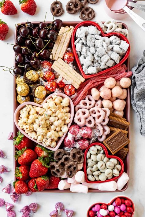 Making a fun Valentine's Day Dessert Board is a fun and easy way to celebrate this day of love! Just grab a large board or baking sheet, some inexpensive heart-shaped bowls, and load it up with your favorite goodies and fresh fruit for a spread the is sure to make everyone fall in love! | valentines day charcuterie board ideas | valentines day charcuterie board dessert | charcuterie board ideas for valentines day | dessert charcuterie board valentines day Charcuterie Board Ideas Valentines, Charcuterie Board Valentines, Valentines Day Charcuterie Board, Valentines Day Charcuterie, Dessert Charcuterie Board, Orange Julius Recipe, Dessert Charcuterie, Hot Crab Dip, Dessert Board