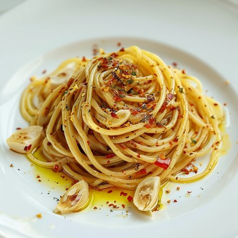 Spaghetti Aglio Olio e Peperoncino A simple yet flavorful dish from Naples, combining garlic, olive oil, and chili flakes for a quick and satisfying meal. 🌶️ Spaghetti Chili, Spaghetti Aglio Olio, Spaghetti Aglio, Aglio Olio, Garlic Olive Oil, Food Pics, Chili Flakes, Satisfying Food, Food Pictures