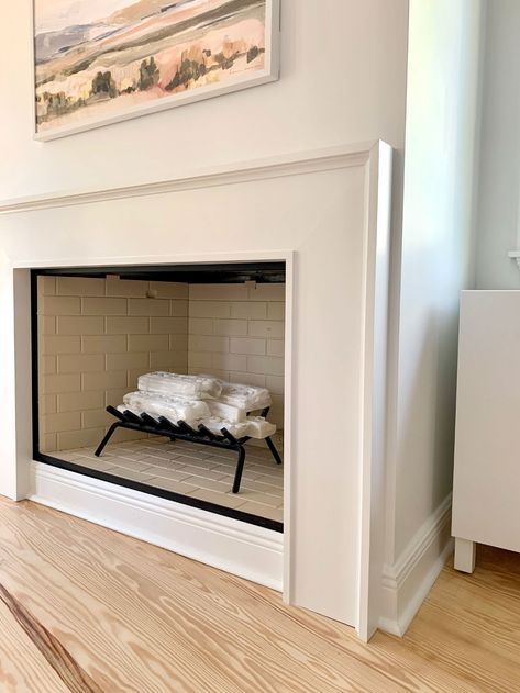 How We Built An Easy Modern Fireplace Mantel... Just In Time For Stockings! | Young House Love Fireplace Hearth Decor Modern, Contemporary Fireplace Surround, Small Diy Fireplace, Modern Mantle Ideas, Simple Wood Fireplace Surround, Mdf Fireplace Surround, Pole Wrap Fireplace, Boho Fireplace Ideas, Diy Fireplace Mantle Surround