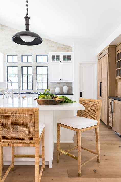 The bright and airy kitchen was met with black finishes and hardware. While working with all of the black and white, we warmed up the space with wood tones and woven rattan counter stools. The warm hues worked harmoniously together and really made this kitchen feel like the heart of the home! Lindye Galloway, Rattan Counter Stools, Beautiful Kitchen Designs, California Modern, Classic Kitchen, Interior Modern, Kitchen Inspiration Design, Woven Rattan, Modern Farmhouse Kitchens