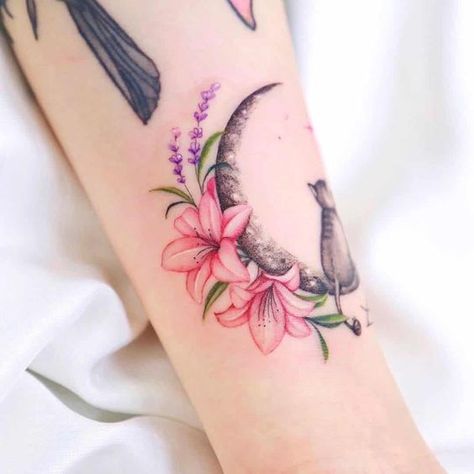 The Best Lily Tattoo and What They Mean Pink Tiger Lily Tattoo, Bee And Lily Tattoo, Dragonfly Lily Tattoo, Delicate Lily Tattoo, Lily Color Tattoo, Pink Lilly Tattoo, Stargazer Lilly Tattoo, Lily Flower Tattoos Sleeve, Lilly Tattoo Color