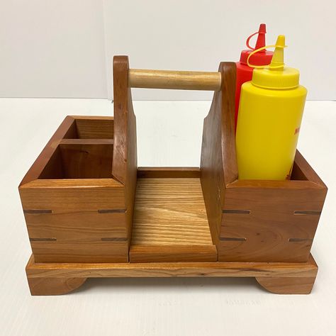 Free shipping to US and Canada Vintage wooden kitchen caddy, condiment holder with handle kitchen organizer farmhouse house decor tabletop crate  It is in great condition with no cracks or breaks. It comes with the ketchup and mustard bottle as well.  Please keep in mind that all my items are pre-owned and may show some wear from usage over the years.  However, I will describe them as best as I can and take pictures clear enough to see their condition.  Please take a look at the pictures as they Vintage Wooden Kitchen, Farmhouse House Decor, Small Scale Furniture, Wooden Caddy, Wooden Kitchen Accessories, Kitchen Caddy, Condiment Caddy, Wooden Tool Boxes, Wood Craft Projects