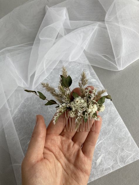 * This delicate hair comb made with Eucalyptus Natural dried different flowers. *Complement most wedding hairstyles. It is the perfect bridal hair vine for that woman who wants to simply sparkle on her wedding day. Dimensions: 5 cm x 12 cm IMPORTANT DELIVERY INFORMATION: All parcels to United States will be delivered via USPS - 7-10 business days, If you bought 35 $ or 40 € with a coupon in our store, we send byregular mail and delivery time to USA is 2-6 weeks. To Europe 1-3 weeks . If you want Flower Comb Wedding Hair, Wedding Hair Dried Flowers, Dried Floral Hair Piece Wedding, Boho Wedding Hair Pieces, Diy Bridesmaid Hair, Dried Flowers Hair Comb, Boho Flower Hair Comb, Eucalyptus Hair Comb, Dried Flower Hair Comb