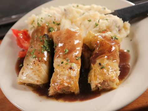 Lamb-Stuffed Cabbage with Red Wine Demi-Glace from Diners, Drive-ins, & Dives The Irish Rover, Charlotte, NC Irish Dishes, Stuffed Cabbage, Ground Lamb, Cabbage Rolls, Cabbage Recipes, Irish Recipes, Lamb Recipes, Charlotte Nc, Food Network