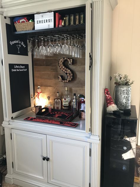 Whiskey Bar Cabinet Ideas, Diy Bar From Tv Cabinet, Entertainment Center Turned Into Bar, Entertainment Center Liquor Cabinet, Painted Bar Cabinet Ideas, Entertainment Center Bar Ideas, Repurposed Liquor Cabinet, Refinished Entertainment Center, Tv Armoire Repurposed Bar Liquor Cabinet