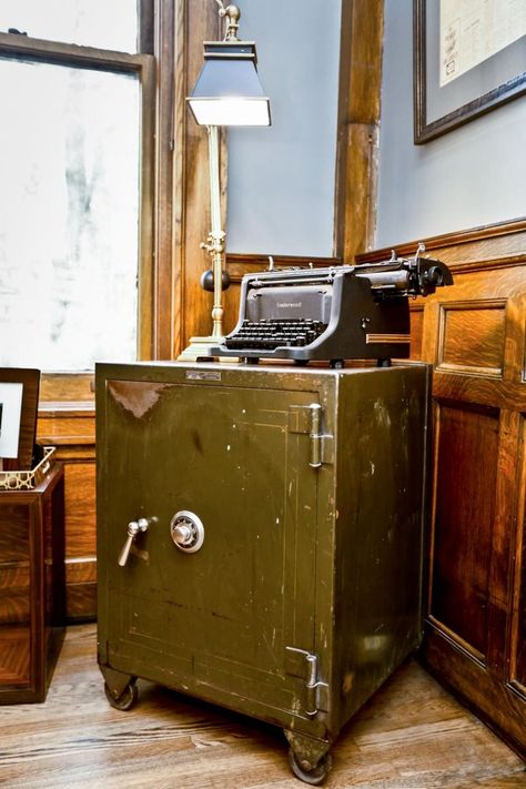 In the study of the Summit Avenue mansion, expert rehabber Nicole Curtis decorates the study with a repurposed old safe that she found in the basement and a typewrite that she got at an estate sale. Nicole Curtis Rehab Addict, Rehab Addict, Antique Safe, 1920s Interior Design, Nicole Curtis, Hiding Ugly, Hgtv Star, Safe Vault, Vault Doors