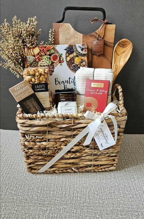 Gift Basket Ideas For Housewarming, Cheeseboard Gift Basket Ideas, Wedding Gift Basket Ideas For Couple, Cookbook Gift Basket, Bridal Shower Baskets For Bride, Cooking Baskets Gift Ideas, Wedding Gift Baskets For Bride And Groom, Engagement Basket Ideas, Wedding Shower Gift Basket Ideas