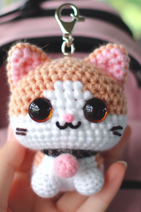 Make an adorable crochet cat keychain with this easy-to-follow pattern. Perfect for beginners and great as a cute accessory! Crochet Cat Keyring Free Pattern, Cat Amigurumi Keychain, Chunky Cat Crochet Pattern, Crochet Cute Keychain Free Pattern, Crochet Cat Keychain Pattern Free, Key Chains Crochet, Mini Cat Crochet, Keychain Crochet Ideas, Cat Crochet Keychain