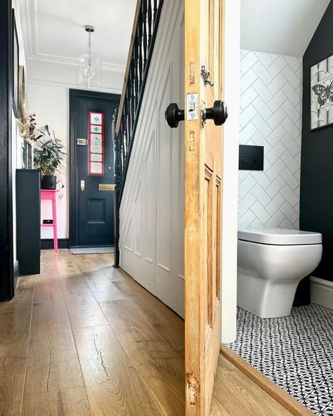 Katherine | Interior design & DIY on Instagram: "It’s been a while since the downstairs loo has graced the grid!   It’s amazing what you can fit into a small space. We boxed in all the pipe work and cistern behind stud walls to make it look neater, plus have a short projection toilet and small wall hung sink. Scroll across to see how we’ve hidden the fuse box and gas electricity meter.  Next to the cloakroom, we have a small cupboard for shoes - it used to also have coats but I’m waiting on the sliding rack to be fixed (it was broken during a game of hide and seek over a year ago 😆) I’ll pop a picture of the cupboard on stories!  What’s under your stairs? . Cloakroom painted in Off Black by @farrowandball  Floor tiles are @firedearthuk  Taps are @crosswater_uk  . #cloakroom #downstairstoi The Space Under The Stairs, Understairs Toilet, Wall Hung Sink, Bedroom Built In Wardrobe, Small Cupboard, Under Stairs Cupboard, Narrow Bathroom, Under The Stairs, Downstairs Loo