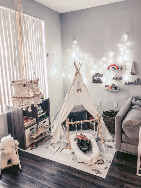 My husband & I just moved from a 4 bedroom 3,000 sq ft house to a three bedroom 1,300 apartment in Phoenix, Arizona so we no longer had the additional room to make into a playroom for our son, so I thought “why not make a play area in the corner of our living room” Link for lights https://www.walmart.com/ip/AGPtek-120LED-9-84ft-Linkable-Window-Ball-Curtain-Light-String-w-8modes-Pure-White/110407080 Link for mat https://www.amazon.com/dp/B07V1PHJYS/ref=cm_sw_r_cp_api_glc_fabc_lP69FbTHXGSJE Kids Play Corner, Kid Friendly Living Room, Baby Play Areas, Kids Play Spaces, Play Corner, Living Room Playroom, Baby Corner, Baby Playroom, Kids Living Rooms