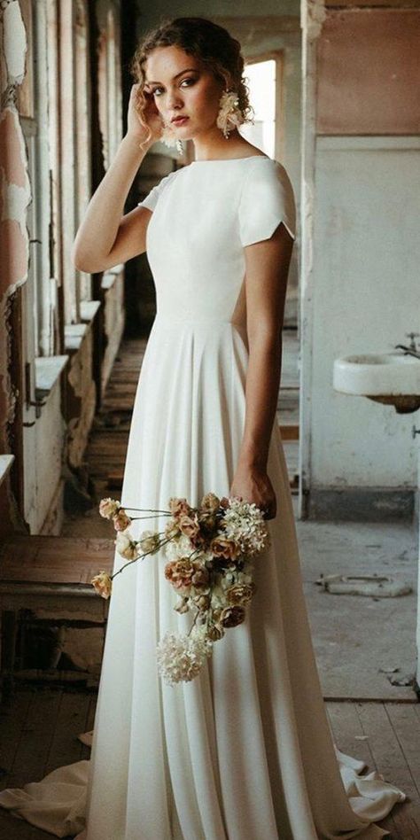 Of The Most Graceful Simple Wedding Dresses With Sleeves ★ #bridalgown #weddingdress Simple Wedding Dresses With Sleeves, Simple Wedding Dress With Sleeves, Dresses With Sleeves Wedding, Sleeves Wedding Dresses, Simple Wedding Dresses, Short Sleeve Wedding Dress, Wedding Dress Cap Sleeves, Wedding Dress Guide, Minimalist Wedding Dresses