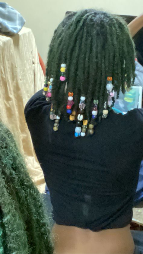 Dyed Locs Green, Green Dreadlocks Black Women, Beads On Dreads Locs, Green Locs Men, Green And Black Locs, Green Natural Hair Black Women, Green Butterfly Locs, Locs With Beads Black Women, Decorated Locs