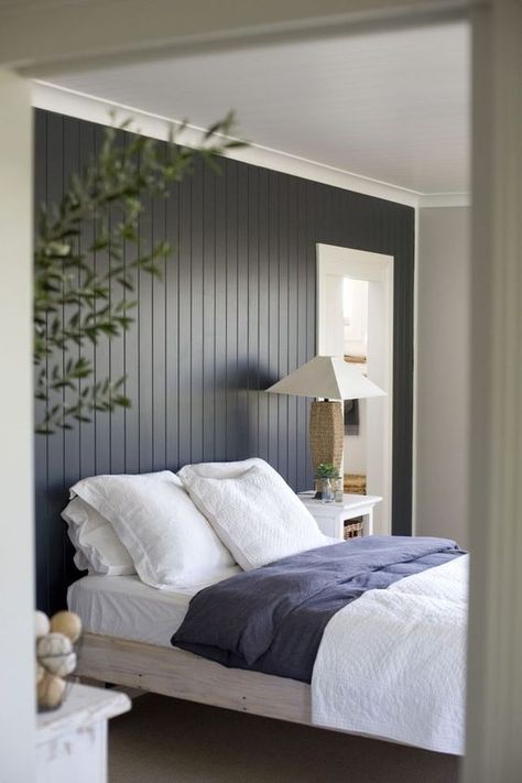 The dark painted wood paneling feature wall makes quite a statement in this simple yet sophisticated bedroom.: Vertical Paneling, Wall Behind Bed, Paneling Makeover, Feature Wall Bedroom, Mdf Panel, Painted Paneling, Studio Mcgee, Remodel Bedroom, Main Bedroom