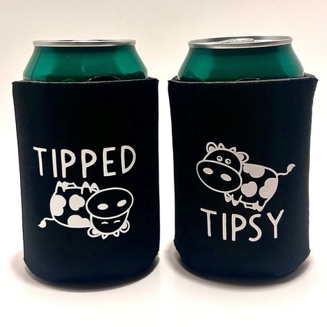 "Introducing our delightful Tipped and Tipsy Cow Koozie Set - the perfect blend of practicality and charm for keeping your beverages cool! Embrace the whimsy of these adorable cows gracing each koozie. One koozie features a cheerful cow proudly declaring \"Tipsy\" right side up, embodying the relaxation of your refreshing moments. Meanwhile, its playful counterpart showcases a sleepy cow upside down, humorously stating \"Tipped\". Crafted with quality and a touch of playfulness, these koozies are not just insulators for your favorite cans; they're conversation starters that add a touch of whimsy to every sip. Enhance your drinking experience with these delightful bovine companions and make your gatherings unforgettable. Cheers to a perfect blend of utility and fun!  Please hand wash only f Diy Koozies, Baby Shower Koozies, Koozie Design, Cricut Projects Easy, Can Koozie, Halloween Cans, Cow Gifts, Wine Glass Set, Ceramic Coasters