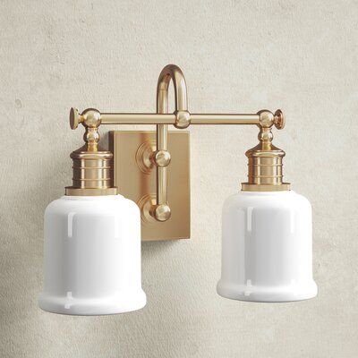 Fixture’s combination of strength and refinement is equally at home in a country manor or an urban apartment. We double-mount the sconce’s gooseneck arm to create a durable and appealing design. Bell-shaped glass, cast swivels, and straight-line knurling on the socket holders enhance vintage character. Color: Aged Brass | Birch Lane™ Larocque 2 - Light Vanity Light Glass in Yellow, Size 11.0 H x 13.5 W x 8.0 D in | Wayfair | Black Friday / Cyber Monday Deals Milk Glass Light Fixture Bathroom, Double Vanity Lighting, Modern Bathroom Design Lighting, Bathroom Vanity Lights, Country Manor, Light Fixtures Bathroom Vanity, Urban Apartment, Industrial Hardware, Bathroom Ceiling Light